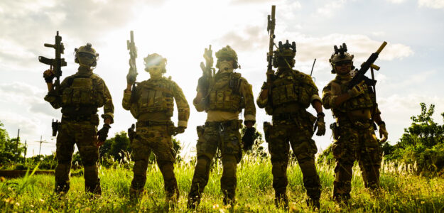 Smart teamwork of soldiers running forward and attacking enemy during military operation, Army